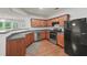Well-equipped kitchen with stainless steel appliances, wood cabinets, and an efficient layout for cooking and entertaining at 162 Ledgewood Mill Way, Lawrenceville, GA 30045
