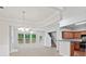 Open concept living space with abundant natural light, a cozy fireplace, and seamless flow into the modern kitchen at 162 Ledgewood Mill Way, Lawrenceville, GA 30045