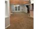Spacious living room featuring plush carpeting, ample natural light, and neutral paint at 162 Ledgewood Mill Way, Lawrenceville, GA 30045