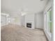 Spacious living room with fireplace, neutral paint, plush carpet and views to the dining room at 162 Ledgewood Mill Way, Lawrenceville, GA 30045