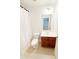 Clean, well-lit bathroom with a single sink vanity and white shower curtain at 3130 Haynes Park Dr, Lithonia, GA 30038