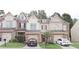 Charming townhome with a well-manicured lawn and inviting curb appeal at 3130 Haynes Park Dr, Lithonia, GA 30038