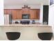 Well-equipped kitchen featuring stainless steel appliances and barstool seating at 3130 Haynes Park Dr, Lithonia, GA 30038