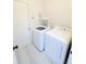 Functional laundry room with white washer and dryer, plus ample space for organizing laundry tasks at 3130 Haynes Park Dr, Lithonia, GA 30038