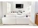Relaxing living room with high ceilings, large windows and an oversized comfortable white sofa at 3130 Haynes Park Dr, Lithonia, GA 30038