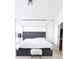 Bedroom view showcases tufted headboard, canopy bed frame, and accent lighting at 3130 Haynes Park Dr, Lithonia, GA 30038