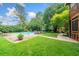 Expansive backyard with a pristine pool, manicured lawn and patio seating for outdoor gatherings at 2578 Morgan Lake Ne Dr, Marietta, GA 30066