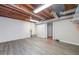 Spacious basement with painted walls and vinyl flooring, with exposed ductwork and utilities at 2578 Morgan Lake Ne Dr, Marietta, GA 30066