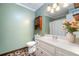 Well-maintained bathroom with single vanity, mirror, and shower/tub combination with tile surround at 2578 Morgan Lake Ne Dr, Marietta, GA 30066