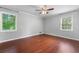 Spacious bedroom with hardwood floors and natural light from two windows at 2578 Morgan Lake Ne Dr, Marietta, GA 30066