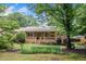 Charming brick home with well-maintained landscaping and a cozy front porch at 2578 Morgan Lake Ne Dr, Marietta, GA 30066