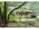 Charming brick home with a welcoming front porch, manicured lawn, and mature trees at 2578 Morgan Lake Ne Dr, Marietta, GA 30066