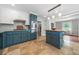 Modern kitchen featuring two-tone cabinetry, stainless steel appliances, and a central butcher block island with pendant lighting at 2578 Morgan Lake Ne Dr, Marietta, GA 30066