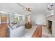 Comfortable living room with brick fireplace, beamed ceiling, hardwood floors, and ample natural light at 2578 Morgan Lake Ne Dr, Marietta, GA 30066