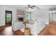 Bright living room with hardwood floors, fireplace, neutral furniture, and view to front door and entry at 2578 Morgan Lake Ne Dr, Marietta, GA 30066