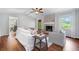 Comfortable living room with brick fireplace, wood floors, neutral decor, and lots of natural light at 2578 Morgan Lake Ne Dr, Marietta, GA 30066