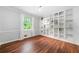 Cozy room with hardwood floors and built-in shelving for storage or display at 2578 Morgan Lake Ne Dr, Marietta, GA 30066