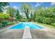 Beautiful backyard featuring a large in-ground pool, diving board and ample space for outdoor entertaining at 2578 Morgan Lake Ne Dr, Marietta, GA 30066
