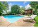 Lounge poolside in this spacious backyard with an in-ground pool, perfect for summer relaxation at 2578 Morgan Lake Ne Dr, Marietta, GA 30066