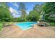 Inviting backyard pool area with lounge chairs and patio seating, perfect for outdoor enjoyment and relaxation at 2578 Morgan Lake Ne Dr, Marietta, GA 30066