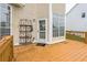 Outdoor deck space with room for entertaining and potted plants at 266 Monarch Village Way, Stockbridge, GA 30281