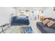 Basement featuring a cozy living area with a sofa and full-sized bed at 266 Monarch Village Way, Stockbridge, GA 30281