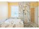 Luxurious bathroom featuring a soaking tub, a stylish glass-enclosed shower, and marble accents at 266 Monarch Village Way, Stockbridge, GA 30281