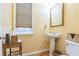 Powder room with pedestal sink, window, and stylish decor at 266 Monarch Village Way, Stockbridge, GA 30281