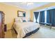 Bedroom with ample natural light, a ceiling fan, and comfortable furnishings at 266 Monarch Village Way, Stockbridge, GA 30281