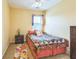 Cozy bedroom featuring a colorful quilt and matching decor at 266 Monarch Village Way, Stockbridge, GA 30281