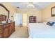 Spacious bedroom with neutral walls, ceiling fan, and a variety of dressers at 266 Monarch Village Way, Stockbridge, GA 30281