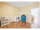 Versatile bonus room featuring hardwood floors, neutral paint, and ample natural light at 266 Monarch Village Way, Stockbridge, GA 30281