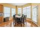 Charming breakfast nook with a large table, surrounded by bright windows and natural light at 266 Monarch Village Way, Stockbridge, GA 30281