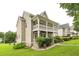 Charming two-story home with a spacious covered front porch and manicured lawn at 266 Monarch Village Way, Stockbridge, GA 30281