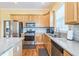 Modern kitchen with stone countertops, stainless steel appliances, and tiled backsplash at 266 Monarch Village Way, Stockbridge, GA 30281