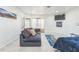Bright living room features a comfortable sofa, large TV, and modern decor at 266 Monarch Village Way, Stockbridge, GA 30281