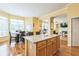 Open-concept living and kitchen area with hardwood floors and natural light at 266 Monarch Village Way, Stockbridge, GA 30281