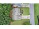 Aerial view of the house with a driveway, landscaped yard, and neighboring houses at 3614 Clearbrooke Way, Duluth, GA 30097