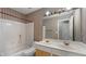 Bathroom with a double sink vanity, tile walls, and tub/shower combo at 3614 Clearbrooke Way, Duluth, GA 30097