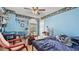 Bedroom with light-blue painted walls and a ceiling fan at 3614 Clearbrooke Way, Duluth, GA 30097