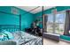Bedroom with turquoise walls, a four-poster bed, a window seat, and a desk at 3614 Clearbrooke Way, Duluth, GA 30097