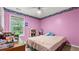 This bedroom features pink walls and an accent border at 3614 Clearbrooke Way, Duluth, GA 30097