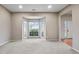 Bright living room features a bay window, neutral carpet, and white trim at 3614 Clearbrooke Way, Duluth, GA 30097