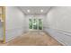 Room with white walls, wainscoting, and large window at 3614 Clearbrooke Way, Duluth, GA 30097