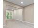 Spacious room with neutral carpet, large window, and recessed lighting at 3614 Clearbrooke Way, Duluth, GA 30097