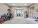 Large, carpeted room with a bay window, and ample space for multiple uses at 3614 Clearbrooke Way, Duluth, GA 30097