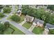 View of the house on a tree-lined street with a two-car garage, manicured lawn, and inviting curb appeal at 3614 Clearbrooke Way, Duluth, GA 30097