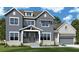 Charming two-story home features a welcoming front porch, attached two car garage, and beautiful modern design at 448 Lower Shoreline Sw Ct, Marietta, GA 30064