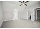 Bright bedroom showcasing modern fixtures, a ceiling fan and ensuite bathroom for added convenience at 202 Dawson Dr, Woodstock, GA 30188