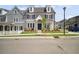 Charming two-story home featuring gray siding, a landscaped yard, and a welcoming front porch at 202 Dawson Dr, Woodstock, GA 30188